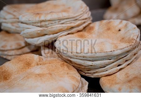 Kuboos Or Khubz - Fresh Pita Bread Togeather In A Table Table