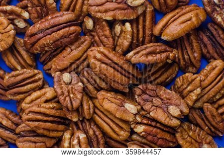 Pekan Nuts Background. Closeup Pekan Seeds. Top View