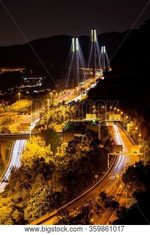 Sunset and light illumination of Tsing ma bridge landmark suspension bridge in Tsing yi area of Hong Kong China.