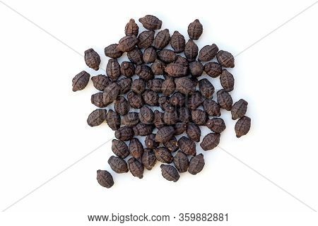Black Seeds Of Mirabilis Flower Top View. Dry Seeds Of Mirabilis Flower On A White Background Close-