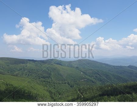 Panorama Of Beskids Mountains Land Near Salmopol Pass View Above European City Of Szczyrk In Poland,