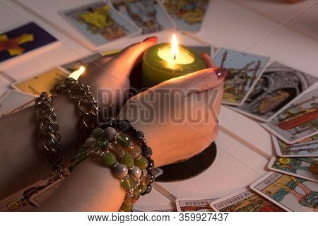 Bangkok,thailand,march.15.20.the Girl Holds Wedding Rings On Her Hand With Tarot Cards,crystals,a Ma
