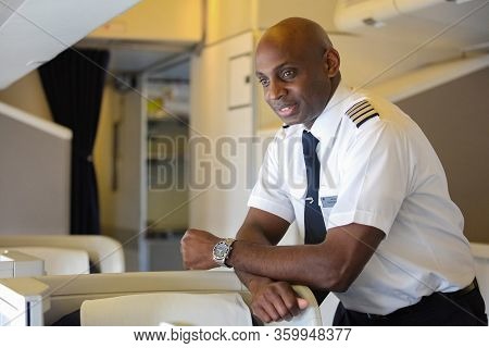 British Airways Middle Aged Africam Male Captain Pilot