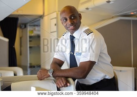 British Airways Middle Aged Africam Male Captain Pilot