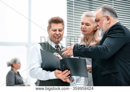 Close Up. The Working Group Discussing Business Document