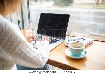 Girl Works On A Laptop. Prints Text. Work At Home. Internet Work. Hands Are Typing. Home Based Busin