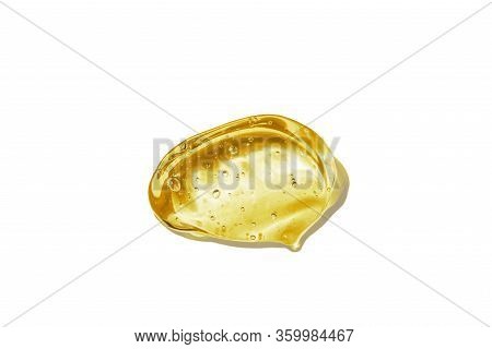 Vitamin C Serum, Cosmetic Gel Texture. Transparent Yellow Gel With Bubbles In A Beautiful Smear