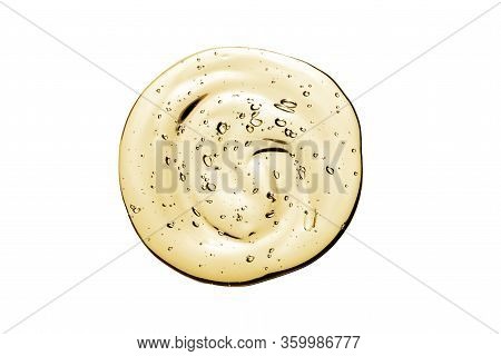 Vitamin C Serum, Cosmetic Gel Texture. Transparent Yellow Gel With Bubbles In A Beautiful Smear