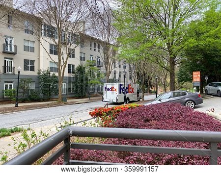 Atlanta, Ga/usa-3/21/20:  A Fedex Truck Delivering Package To Condominiums And Corporate Buildings I