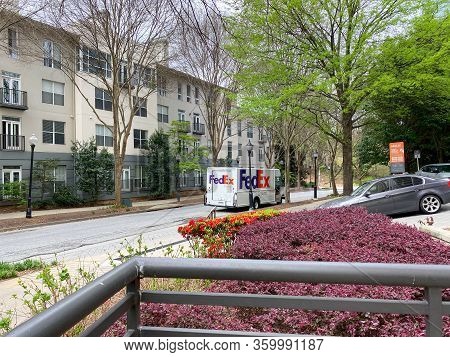 Atlanta, Ga/usa-3/21/20:  A Fedex Truck Delivering Package To Condominiums And Corporate Buildings I