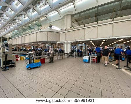 Orlando,fl/usa-3/21/20:  People Going Through Orlando International Airport Mco Tsa Security On A Sl