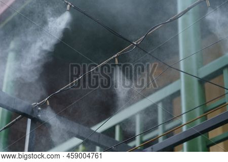 Fogging Outdoor Cool Misting System Working Hot Summer Day For Terrace In Cafe. Facility That Lowers