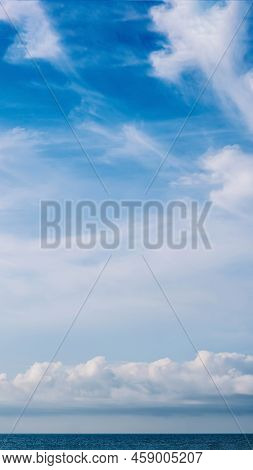 Vertical Panorama Real Photo Natural Cloudscape Wallpaper. Beautiful White Fluffy Cumulus Clouds Sum