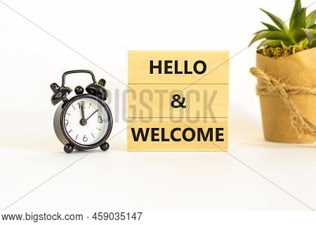 Hello And Welcome Symbol. Concept Words Hello And Welcome On Wooden Blocks. Beautiful White Backgrou