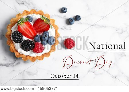 National Dessert Day, October 14. Tasty Tartlet With Different Fresh Berries On White Marble Table