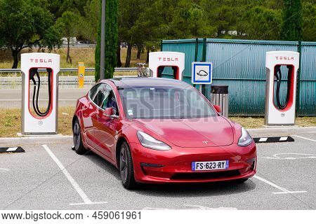 Bordeaux , Aquitaine  France - 07 25 2022 : Tesla Model 3 Charging In Super Charged Station Car Elec