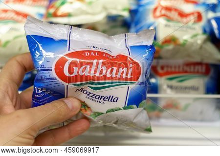 Tyumen, Russia-may 26, 2022: Galbani Cheese In Hand. Dal 1882 Sign On Package No 1 Italy Dairy Chees