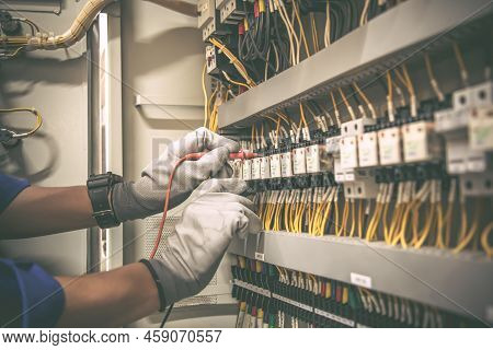 Electricity And Electrical Maintenance Service, Engineer Using Measuring Equipment Tool Checking Ele
