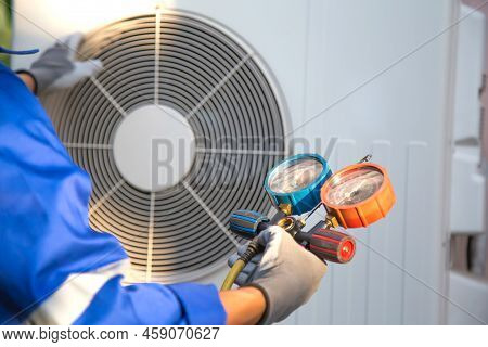 Heat And Air Conditioning, Hvac System Service Technician Using Measuring Manifold Gauge Checking Re