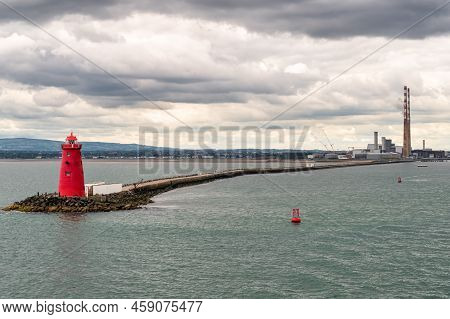 The Red Poolbeg Lighthouse At The Entrance To Dublin Port In Ireland