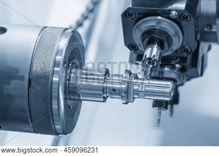 The Multi-tasking Cnc Lathe Machine Swiss Type Milling Cut The Metal Parts By Milling Spindle. The H