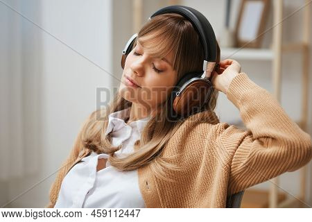 Sleepy Cute Young Blonde Lady In Warm Sweater In Headphones Doing Breakup Of Work Listen Fav Songs S