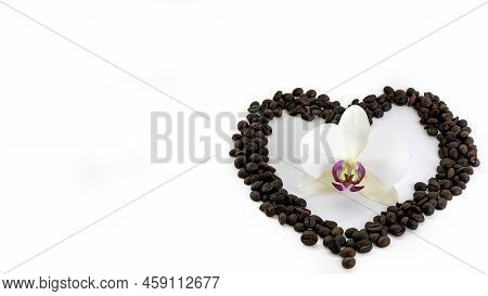 Coffee Beans In The Shape Of A Heart On A White Background Top View
