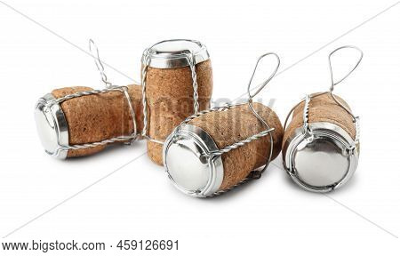 Sparkling Wine Corks With Muselet Caps On White Background