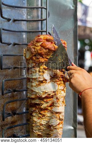Chef Cutting With Doner Knife Traditional Turkish Doner Kebab Meat.