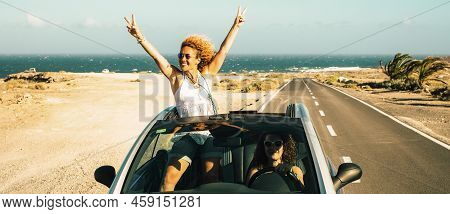 Travel With Car Vehicle And Tourists Summer Destination Concept. Happy And Excited Couple Of Women F