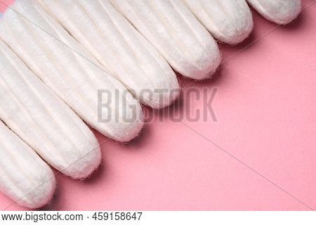 Medical Female Tampon On A Pink Background. Hygienic White Tampon For Women. Cotton Swab. Menstruati