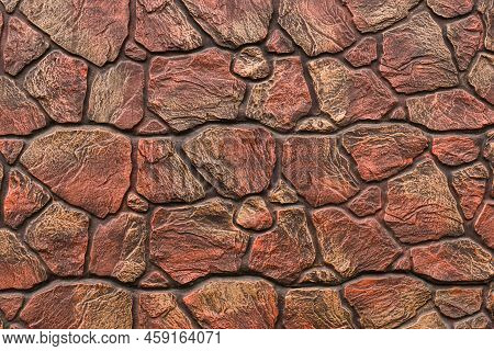 Background From Modering Paving Stones, Irregular Natural Stones. Red Heterogeneous Stone For Backgr