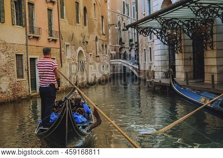 Venice Grand Canal. People Float On Gondolas, Gondoliers. View O