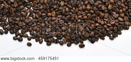 Coffee Beans On A White Background. The Photo Shows Some Grains On A White Background, A Photo For T