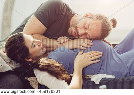 Husband Listen At Tummy Pragnancy Wife Lovely At Home In The Morning Light