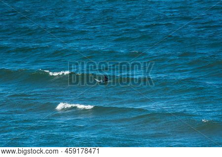A Distant Solitude Surfer On Extreme Cold Lake Superior At Great Sand Bay
