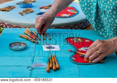 Hands Of Woman Making Bobbin Lace. Colorful Lace Threads. Handmake Craft.