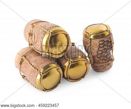 Corks Of Sparkling Wine And Muselet Caps On White Background