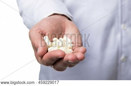Multivitamins Pills Closeup. Multivitamins And Medications. Hands Hold Multivitamins
