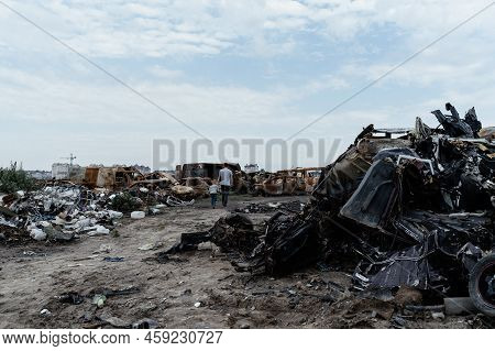 War In Ukraine: A Dump Of Shot And Burned Cars, Bucha District