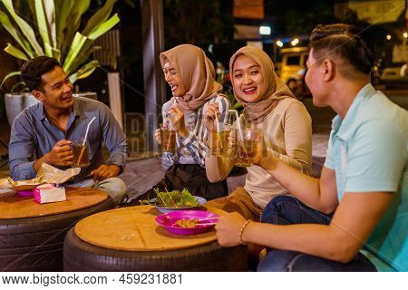 Happy Muslim Friend Enjoy Having Iftar Dinner