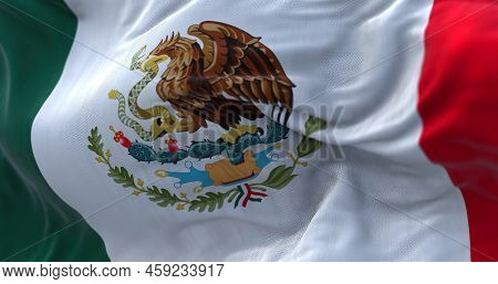 Close-up View Of The Mexican National Flag Waving In The Wind. Mexico Is A Country In The Southern P