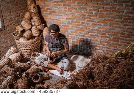 Top View Of Water Hyacinth Craftsman Making Baskets