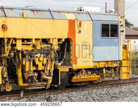 The Ballast Tamping Machine Is Working To Maintain The Sleeper And Ballast Stone In The New Railway 
