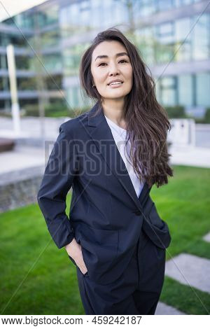 Relaxed And Confident Asian Business Woman In Suit Smiling. Job, Work Aspirational Concept, Backgrou