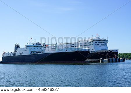 Two Large Ro-ro Cargo And Passenger Ferries Moored In The Seaport