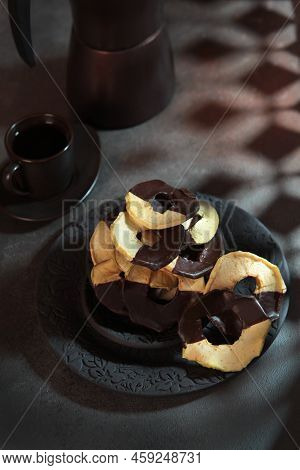 Dried Fruits From Apples With Chocolate. Dried Apples. Apple Chips With Chocolate On Ceramic Plate. 