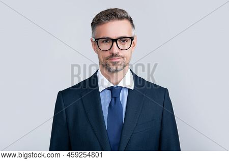 Smiling Mature Lawyer Wearing Glasses And Business Suit