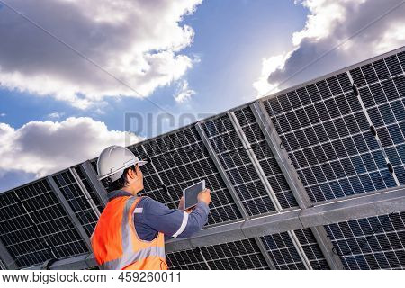Technicians Are Checking The Operation Of The Solar Power Plant Equipment So That The Power Generati