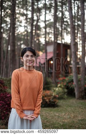 Happy Woman In Sweater Traveling In Pine Tree Forest, Tourist Visit At Doi Bo Luang, Chiang Mai, Tha